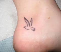 Little ankle tattoo of a pigeon on Phini.